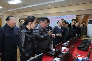 N. Korea's Kim, daughter test pistols together at munitions factory